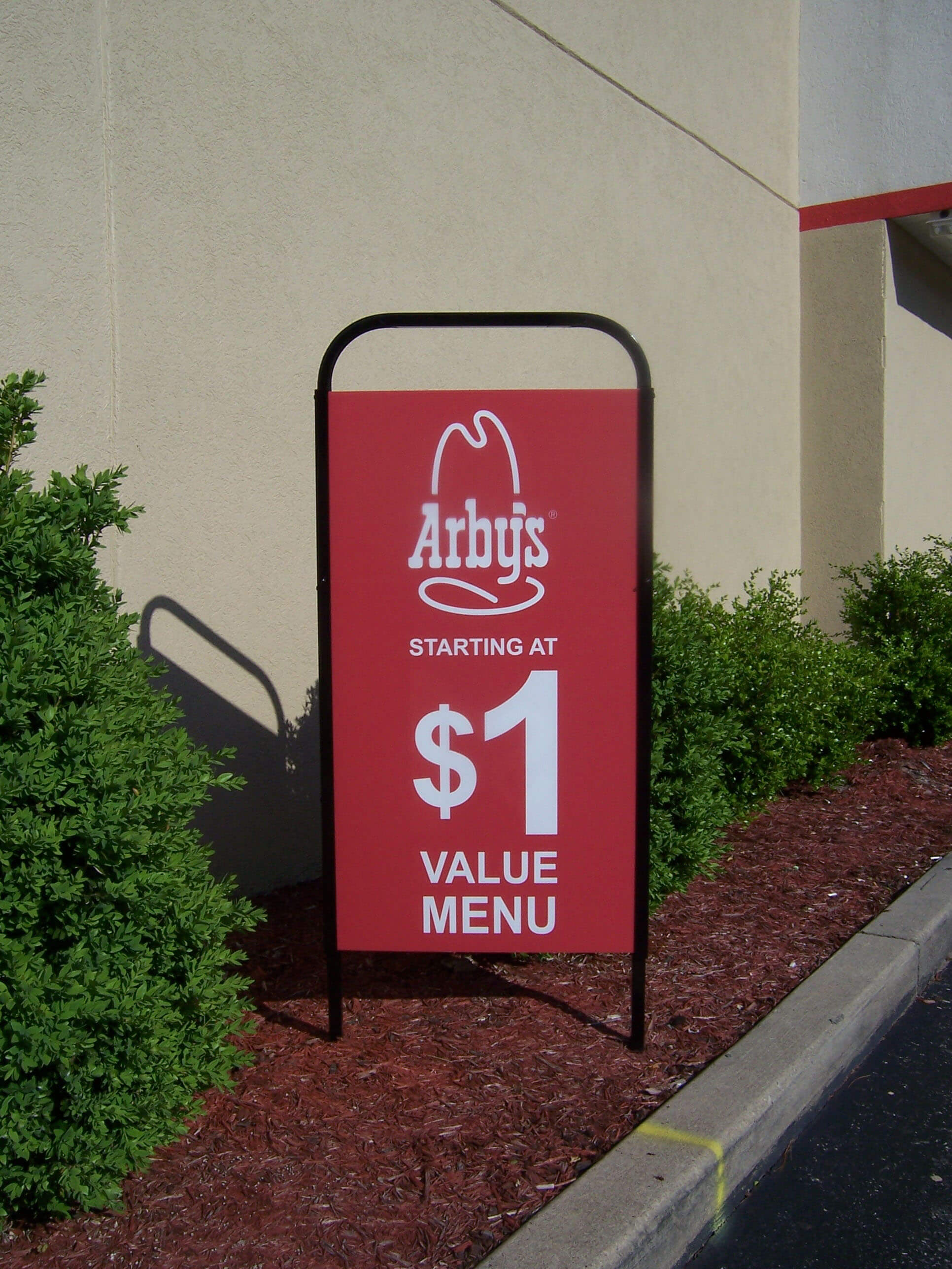 Outdoor marketing using drive thru displays by Voxpop Marketing Systems Exterior merchandising with drive thru displays at Arbys